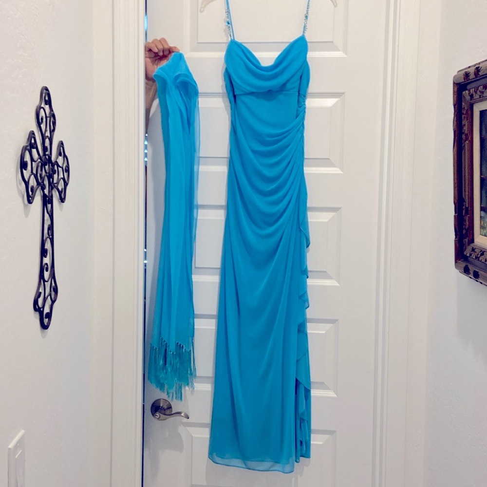 Blue almost turquoise strappy dress with gems on the straps.